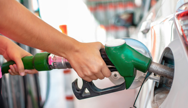 Filling,Up,The,Car,With,Petrol.,Woman's,Hands,Pouring,Gasoline